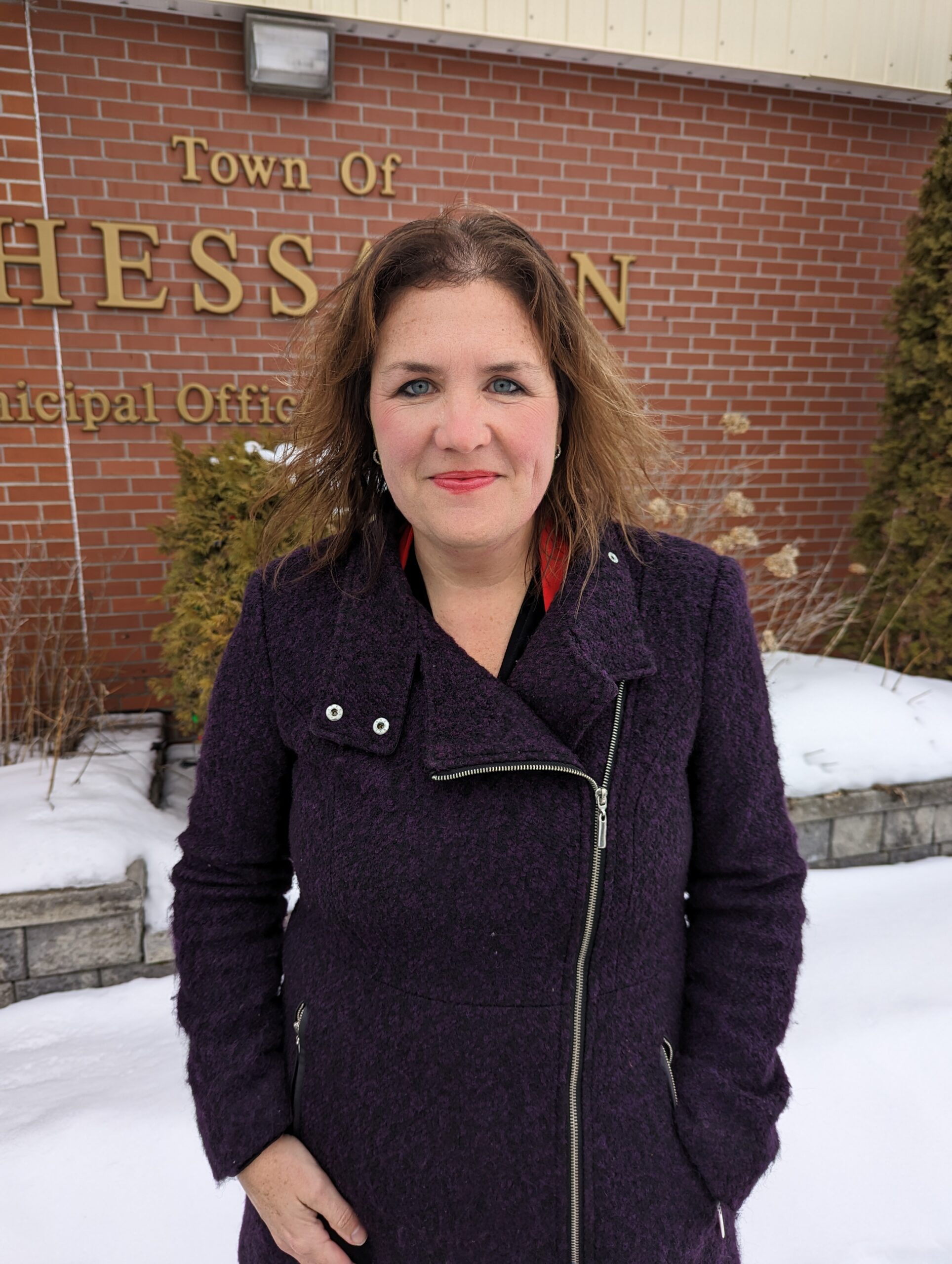 Photo of Tracey outside of the Town of Thessalon Municipal Office